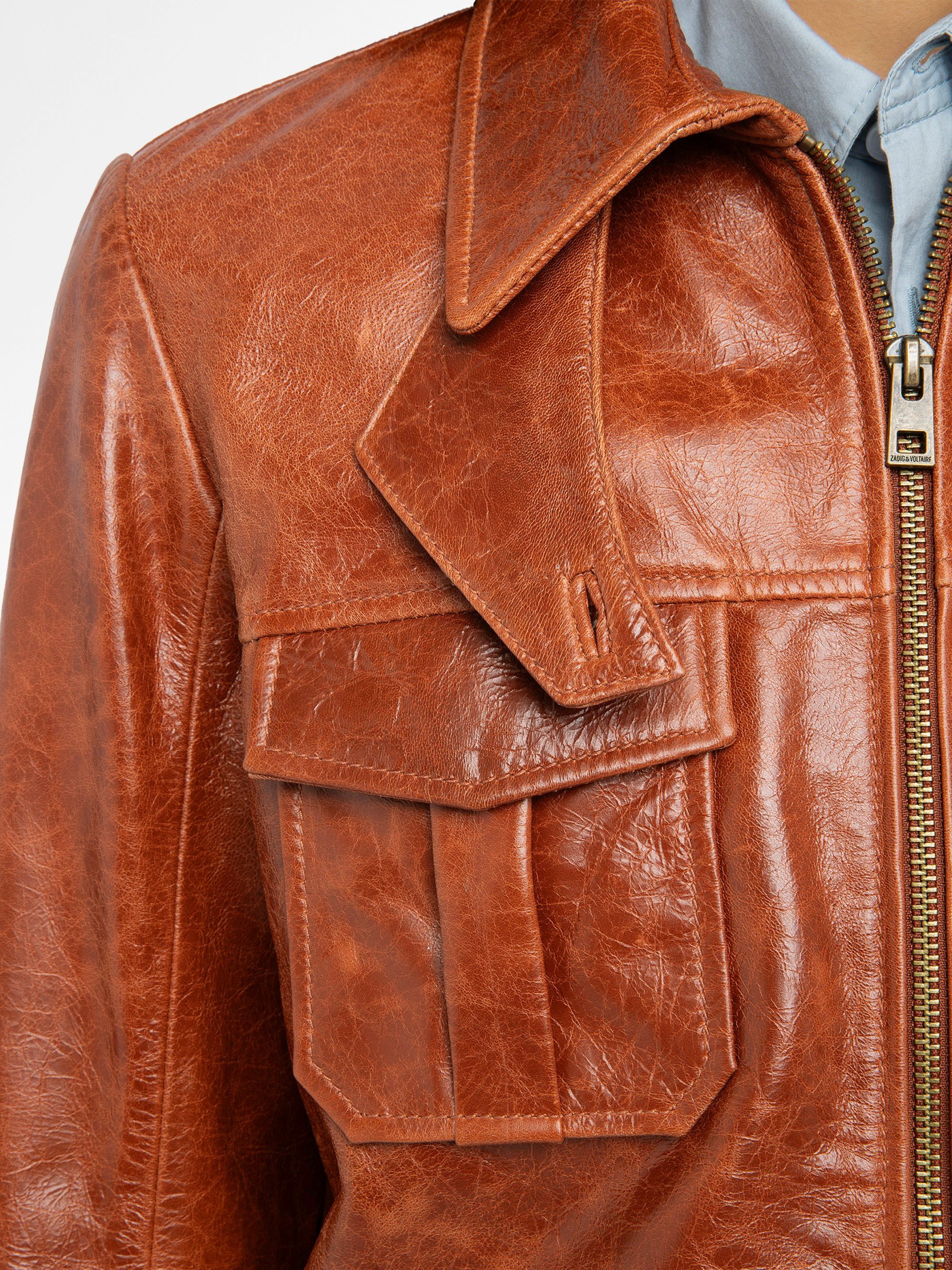 Lienna Leather Jacket - Glossy leather jacket with multiple pockets featuring zip closure and embossed wings on the back.